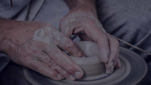 picture of hands creating ceramic pottery